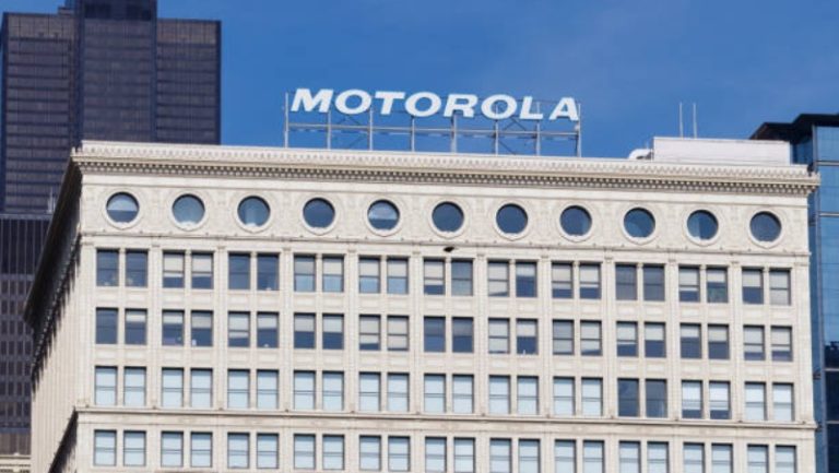 https://media.istockphoto.com/photos/motorola-solutions-logo-atop-the-railway-exchange-building-motorola-picture-id965086702?k=6&m=965086702&s=612x612&w=0&h=6XkbIF0RqtB1iP-8hzYTKWXC9lEq_EO_Mhg7v8ZiIiQ=