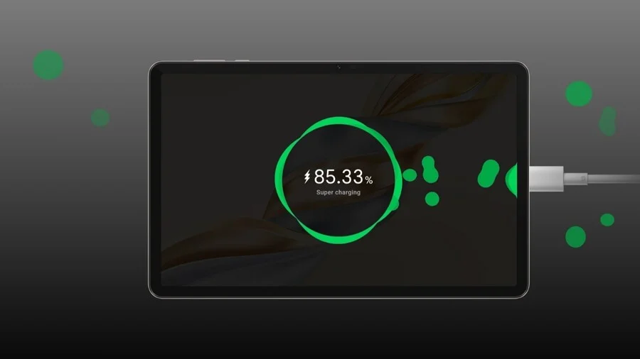 Tablet HONOR Pad X9a je připojen k nabíječce a zobrazuje obrazovku rychlého nabíjení. Uprostřed displeje je zelený kruh s ikonou blesku a textem 85.33% Super Charging' což značí vysokou úroveň nabití a aktivní super rychlé nabíjení.