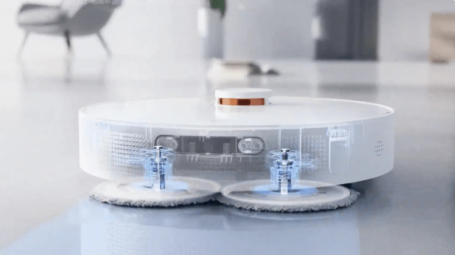 Rentgenová vizualizace vnitřního mechanismu bílého robotického vysavače Xiaomi Robot Vacuum X20+, která ukazuje tlakové rotační podložky pro mokré mopování podlahy.