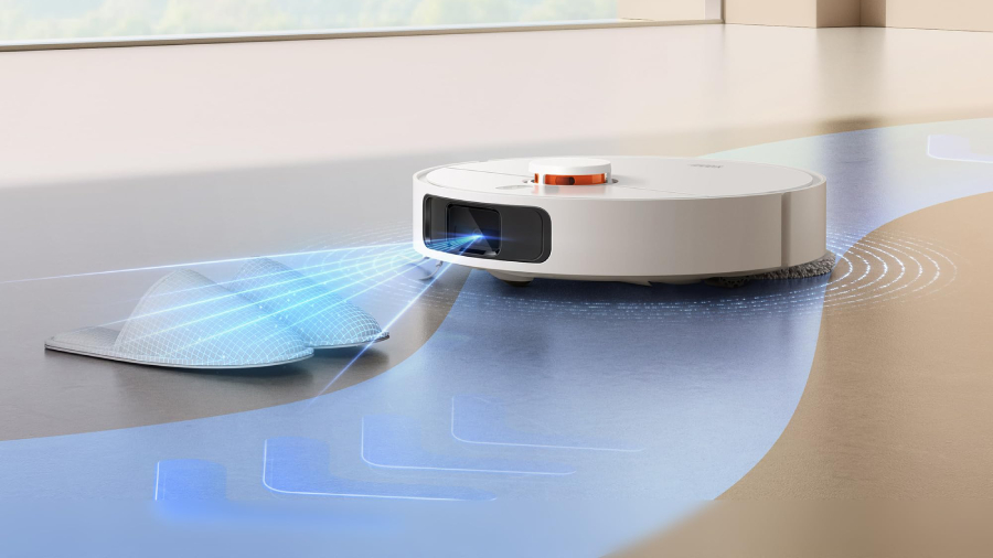 Bílý robotický vysavač Xiaomi Robot Vacuum X20+ skenuje pomocí modrých laserových paprsků domácí obuv na podlaze, aby se jí bezpečně vyhnul.