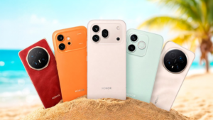 Pět různých mobilních telefonů značky HONOR v písku