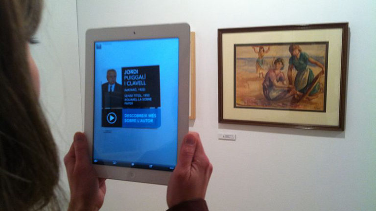 https://upload.wikimedia.org/wikipedia/commons/thumb/a/ad/Augmented_reality_at_Museu_de_Matar%C3%B3_linking_to_Catalan_Wikipedia_%2848%29.JPG/800px-Augmented_reality_at_Museu_de_Matar%C3%B3_linking_to_Catalan_Wikipedia_%2848%29.JPG